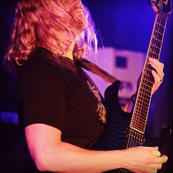 Nathan Smith mid-performance on guitar