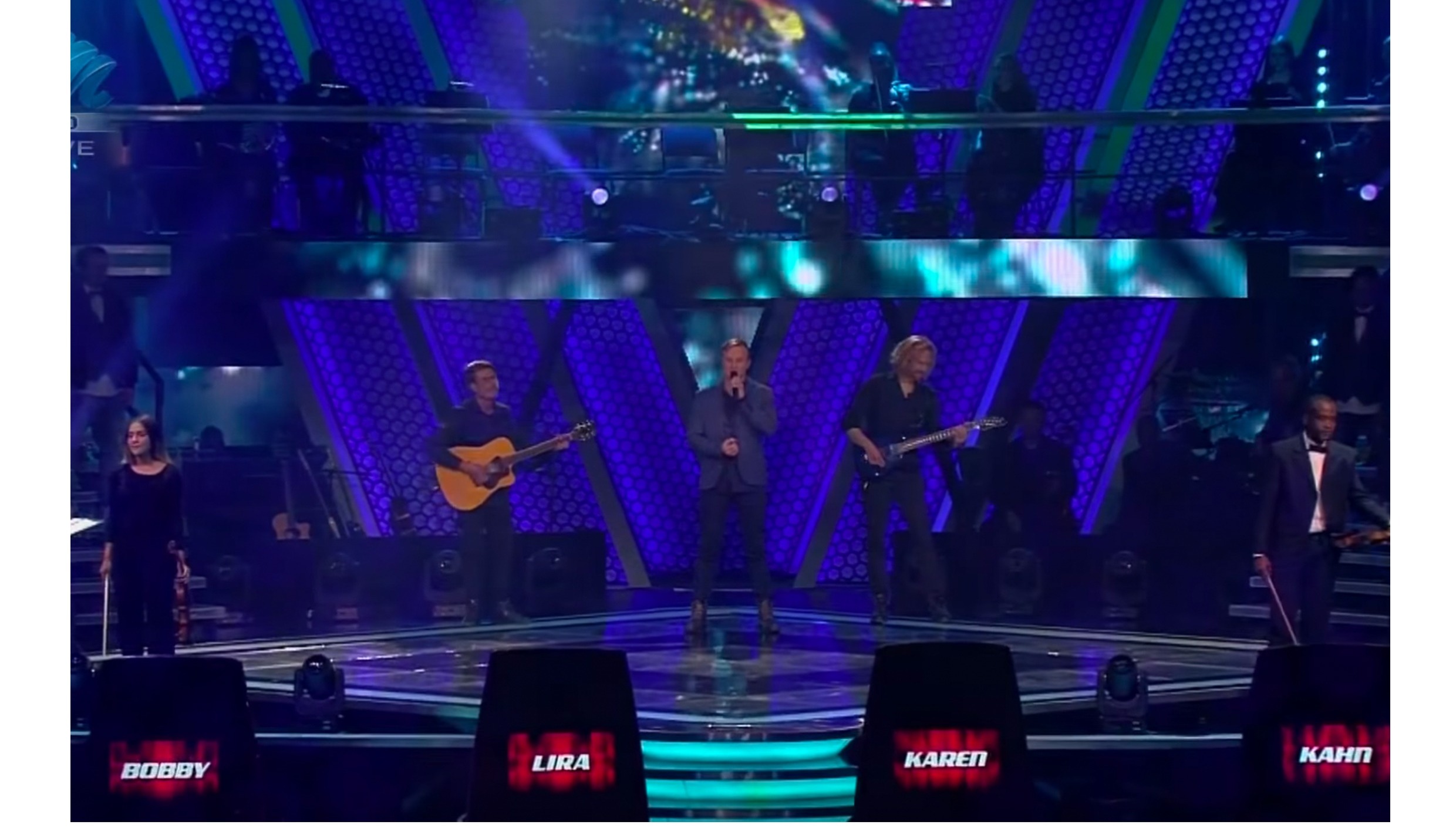 Nathan Smith performing live on The Voice stage